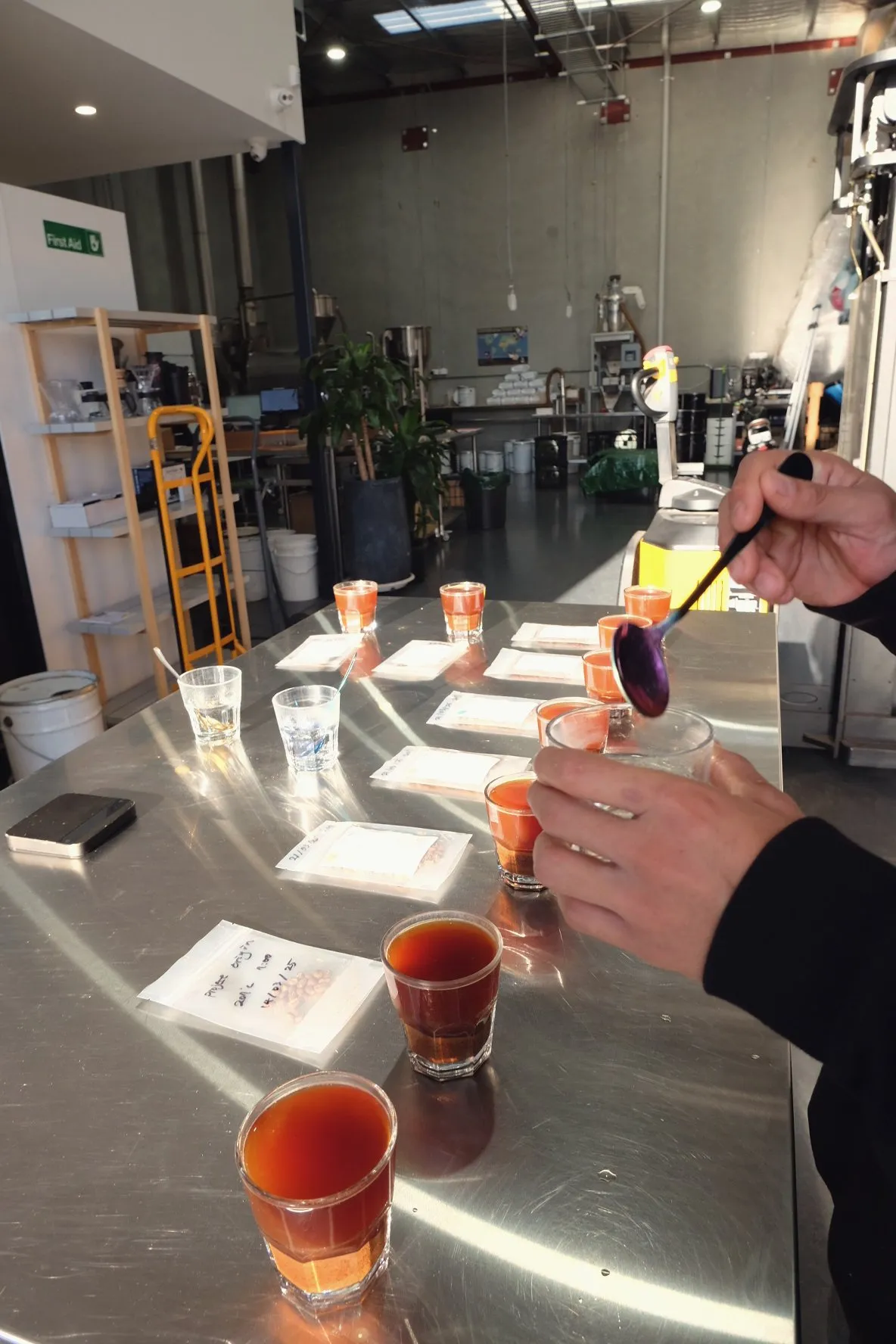Pouring brewed coffee samples for tasting